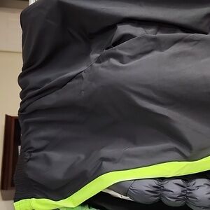 Black joggers with neon green side stripe